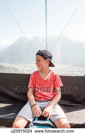 Boy resting on peak, Bludenz, Vorarlberg, Austria View Large Photo Image Picture - Boy resting on peak, Bludenz, Vorarlberg, Austria. Fotosearch