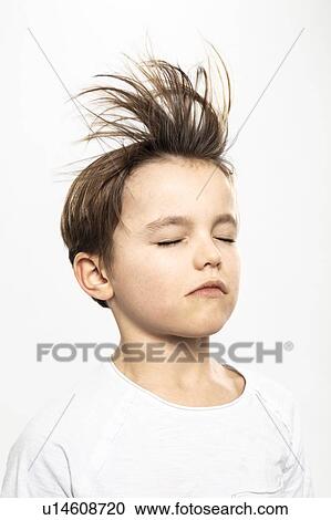 Boy with flying hair closing eyes, white background View Large Photo Image Stock Image - Boy with flying hair closing eyes, white background. Fotosearch