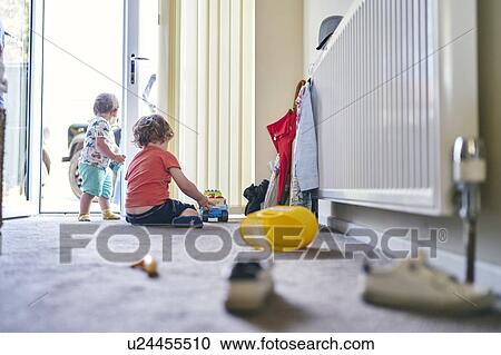 Boys playing with toy trucks and assorted toys on rug View Large Photo Image Stock Image - Boys playing with toy trucks and assorted toys on rug. Fotosearch