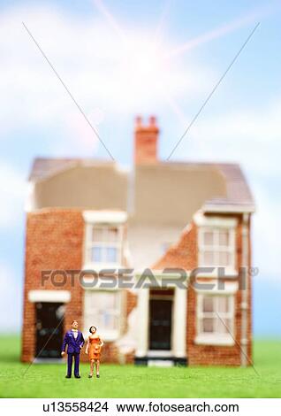 Broken minature house figure with people outside View Large Photo Image Picture - Broken minature house figure with people outside. Fotosearch