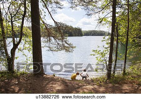Brothers exploring forest, Finland View Large Photo Image Stock Photograph - Brothers exploring forest, Finland. Fotosearch