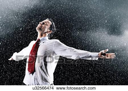 Businessman Caught in heavy Rain View Large Photo Image Picture - Businessman Caught in heavy Rain. Fotosearch