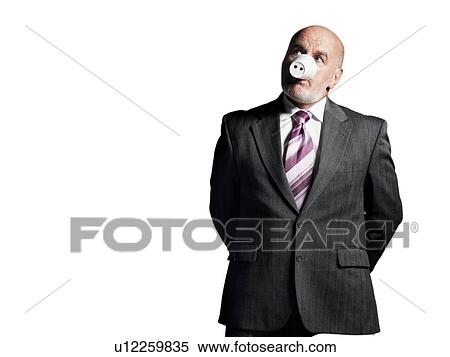 Stock Photography - Businessman Wearing Cup as Pig Snout. Fotosearch