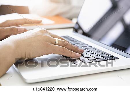 Businesswoman using laptop View Large Photo Image Stock Image - Businesswoman using laptop. Fotosearch