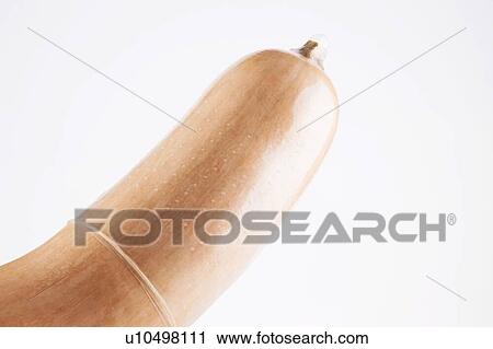 Stock Image - Butternut squash wearing condom concept safe sex. Fotosearch