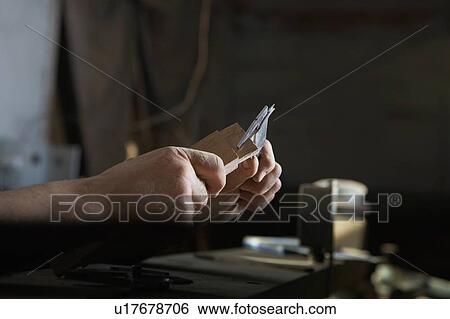 Stock Photograph - Carpenter Measuring Thickness of Wood Piece. Fotosearch