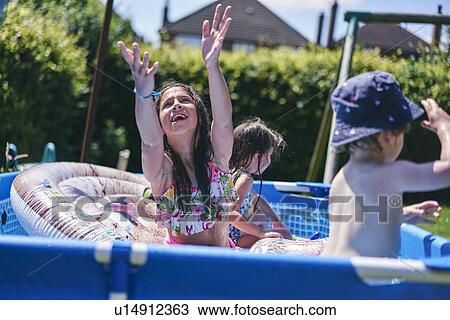 Children playing in inflatable pool View Large Photo Image Stock Image - Children playing in inflatable pool. Fotosearch
