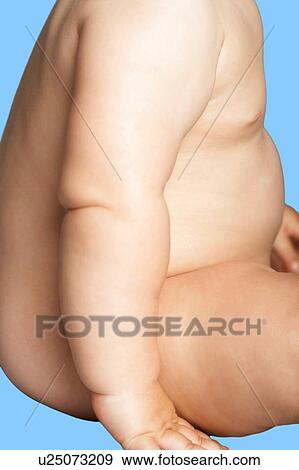 Stock Photo - Chubby Baby Boy against blue background. Fotosearch