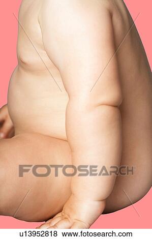 Chubby Baby girl against pink background View Large Photo Image Stock Photo - Chubby Baby girl against pink background. Fotosearch