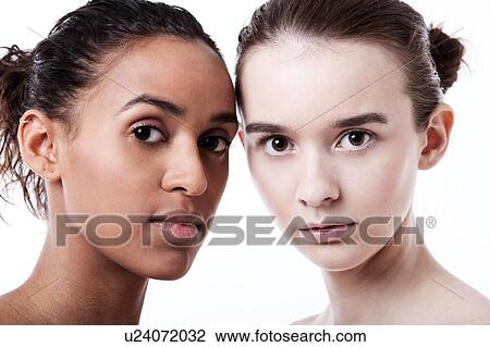 Close up of black and white female faces together View Large Photo Image Stock Image - Close up of black and white female faces together. Fotosearch