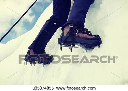 Close up of climber climbing ice mountain in mountainering shoes View Large Photo Image Stock Photography - Close up of climber climbing ice mountain in mountainering shoes. Fotosearch