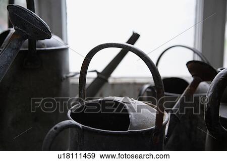 Close-up of old watering cans View Large Photo Image Stock Photo - Close-up of old watering cans. Fotosearch