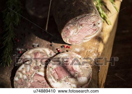 Close up of salami slices, rosemary, peppercorn View Large Photo Image Stock Image - Close up of salami slices, rosemary, peppercorn. Fotosearch