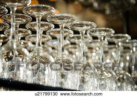 Close up of wine glasses in bar View Large Photo Image Stock Image - Close up of wine glasses in bar. Fotosearch