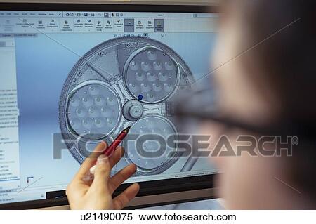 Close up of worker looking at CAD design of product in electronics assembly factory View Large Photo Image Stock Photography - Close up of worker looking at CAD design of product in electronics assembly factory. Fotosearch