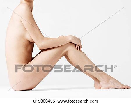 Stock Photography - Close up of young nude woman posing in studio. Fotosearch