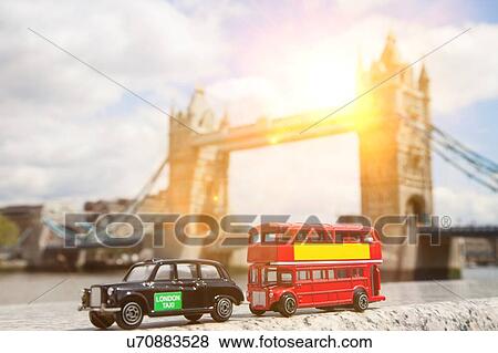 Stock Photo - Close-up view of public transport figurines with Tower Bridge in the background. Fotosearch