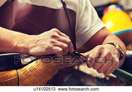 Cobbler craftsman fixing leather boot using tools View Large Photo Image Stock Image - Cobbler craftsman fixing leather boot using tools. Fotosearch