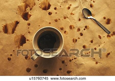 Stock Photography - Coffee cup and spoon with splashes. Fotosearch