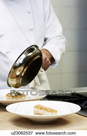 Collage of Chef cooking pan fried cod in kitchen View Large Photo Image Stock Photo - Collage of Chef cooking pan fried cod in kitchen. Fotosearch