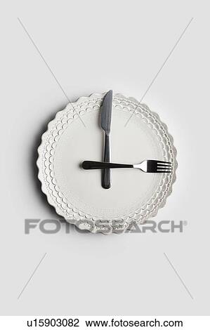 Conceptual image of a food clock View Large Photo Image Stock Image - Conceptual image of a food clock. Fotosearch
