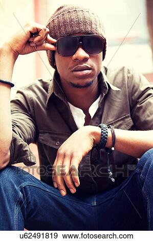 Cool Urban Black Male in Beanie and Shades View Large Photo Image Stock Photo - Cool Urban Black Male in Beanie and Shades. Fotosearch