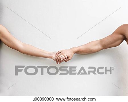 Couple holding hands on white background View Large Photo Image Stock Image - Couple holding hands on white background. Fotosearch