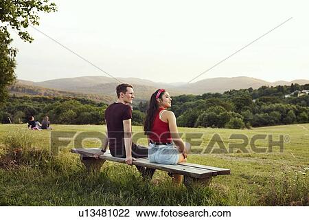 Couple sitting on bench overlooking hills, Wilhelminenberg, Vienna, Austria View Large Photo Image Stock Image - Couple sitting on bench overlooking hills, Wilhelminenberg, Vienna, Austria. Fotosearch