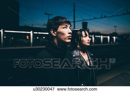 Couple with blank expression in train station, Milan, Italy View Large Photo Image Stock Photo - Couple with blank expression in train station, Milan, Italy. Fotosearch