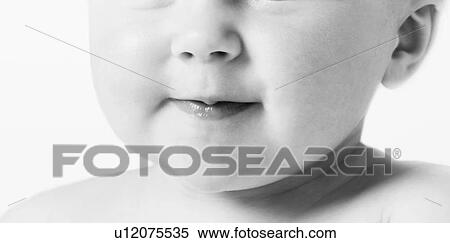 Stock Photography - Cropped black and white photo of baby mouth. Fotosearch