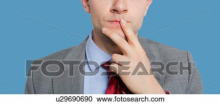 Cropped photo of businessman thinking View Large Photo Image Stock Image - Cropped photo of businessman thinking. Fotosearch