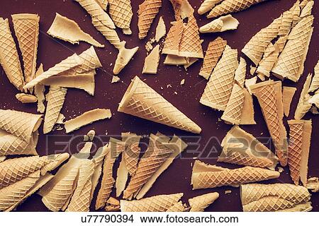 Picture - Crushed ice cream waffle cones. Fotosearch