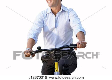 Stock Photography - Cut out of businessman riding bicycle. Fotosearch