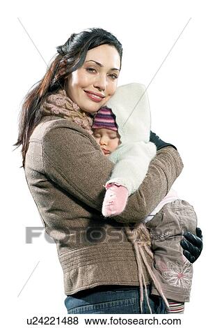 Stock Photo - Cut out of Mother smiling and holding her Baby Girl. Fotosearch