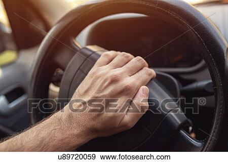 Driver pushing car horn View Large Photo Image Stock Photo - Driver pushing car horn. Fotosearch