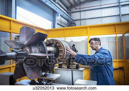 Electrical engineer balancing generator part in electrical engineering factory View Large Photo Image Stock Image - Electrical engineer balancing generator part in electrical engineering factory. Fotosearch