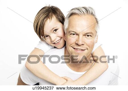 Father giving son piggyback ride, white background View Large Photo Image Stock Photo - Father giving son piggyback ride, white background. Fotosearch