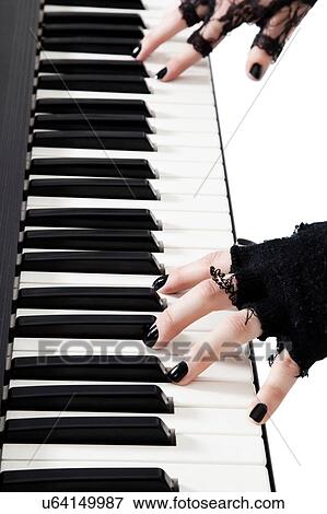 Female goth band playing keyboard piano View Large Photo Image Stock Photo - Female goth band playing keyboard piano. Fotosearch