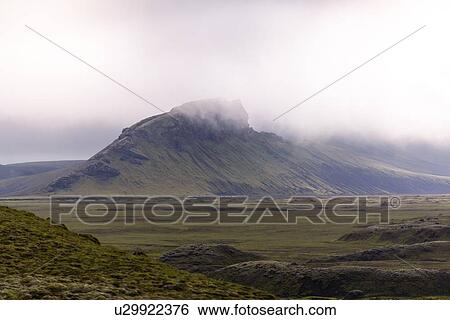 Fog covering peak of mountain range, Landmannalaugar, Iceland View Large Photo Image Stock Photograph - Fog covering peak of mountain range, Landmannalaugar, Iceland. Fotosearch
