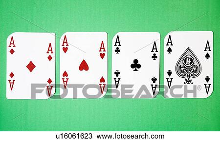 Stock Image - Four Aces against green background. Fotosearch