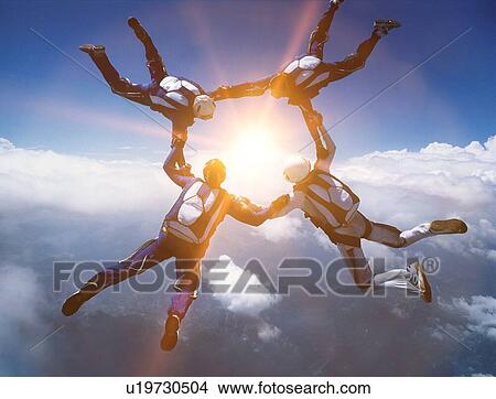 Picture - Four Skydivers in Formation. Fotosearch