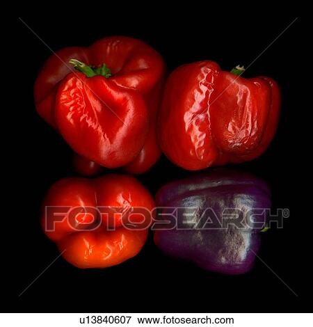 Stock Photo - Four withered bell peppers view from above. Fotosearch