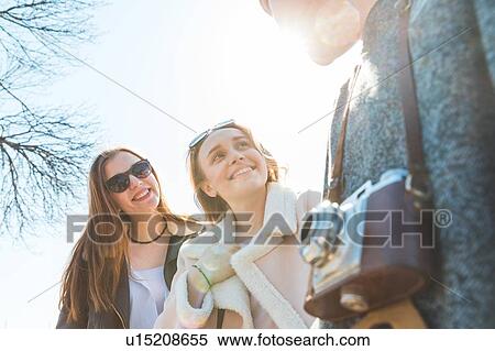 Friends in city on sunny day View Large Photo Image Stock Photography - Friends in city on sunny day. Fotosearch