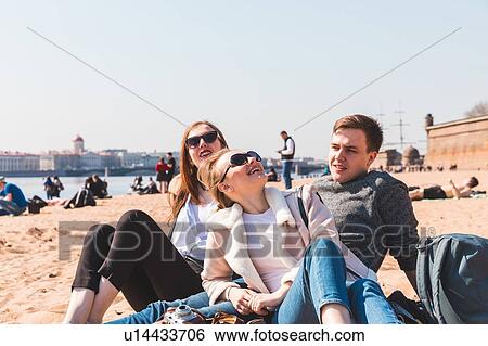 Friends on beach, Saint Petersburg, Russia View Large Photo Image Stock Photograph - Friends on beach, Saint Petersburg, Russia. Fotosearch