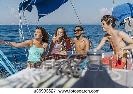 Stock Photo - Friends on sailing holiday, Italy. Fotosearch