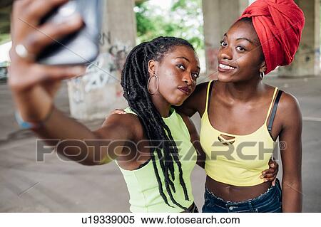 Friends taking selfie in city View Large Photo Image Stock Photography - Friends taking selfie in city. Fotosearch