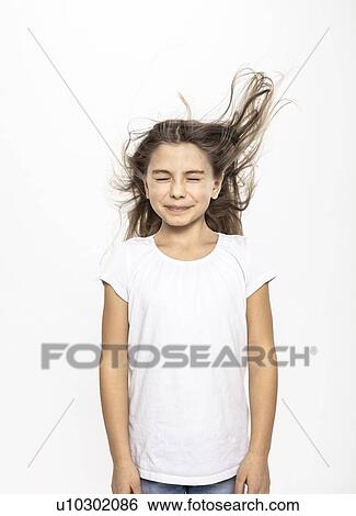 Stock Photograph - Girl with flying hair, white background. Fotosearch
