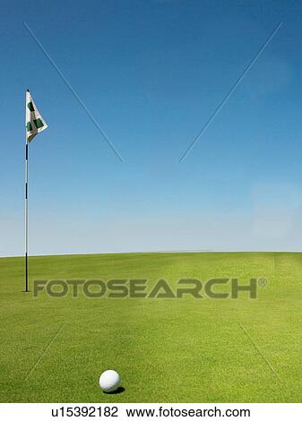 Stock Image - Golf ball on Putting Green. Fotosearch