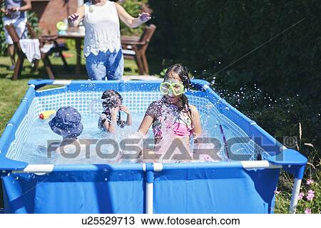 Grandmother watching grandchildren playing in pool View Large Photo Image Stock Image - Grandmother watching grandchildren playing in pool. Fotosearch