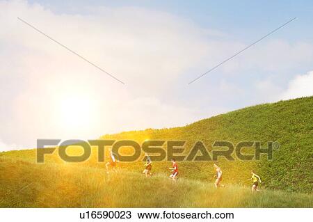 Group jogging up hillside View Large Photo Image Stock Image - Group jogging up hillside. Fotosearch
